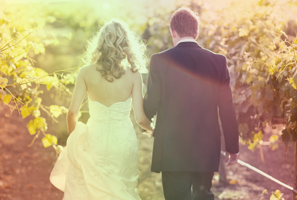 wedding photo by Sarah Yates Photography - bride and groom in vineyard